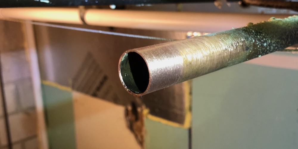 Why do some plumbers stuff white bread into a pipe?